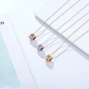Trinity Pendant worn by model, charm necklace style