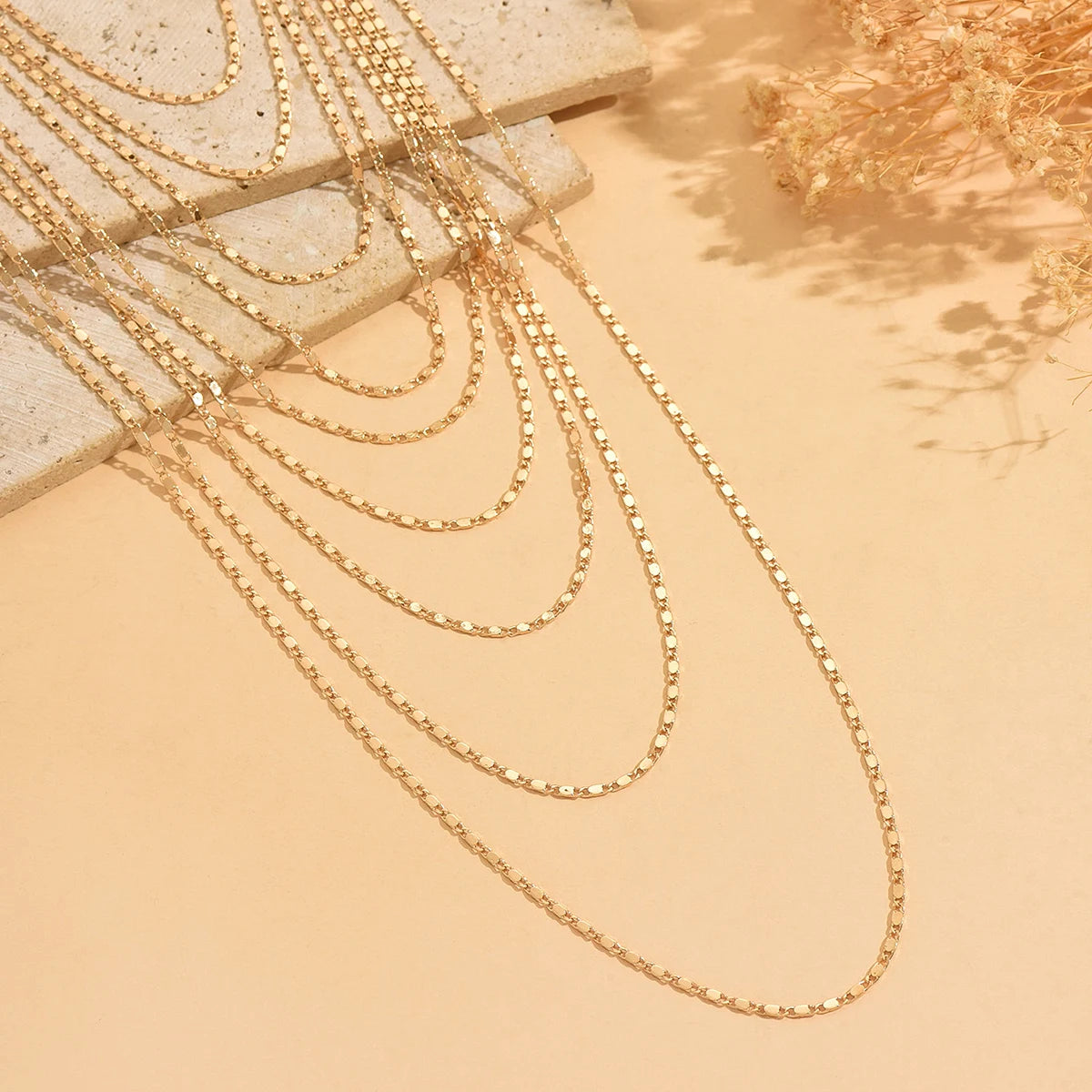 Multi Strand worn by model, stacked chains style