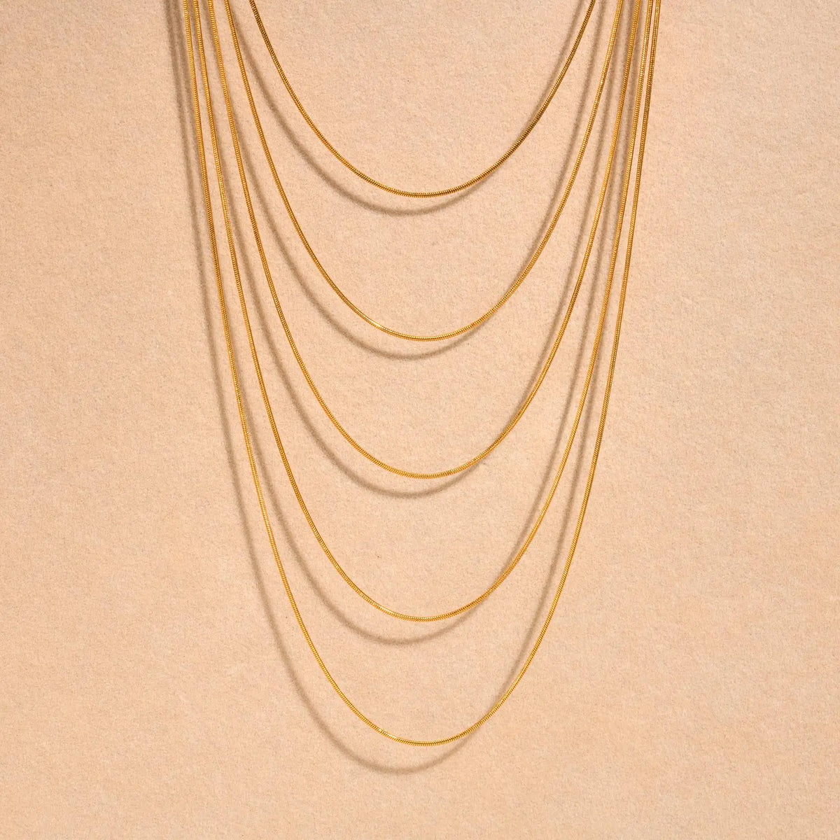 Minimalist Layered worn by model, stacked chains style