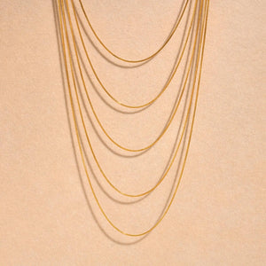 Minimalist Layered worn by model, stacked chains style