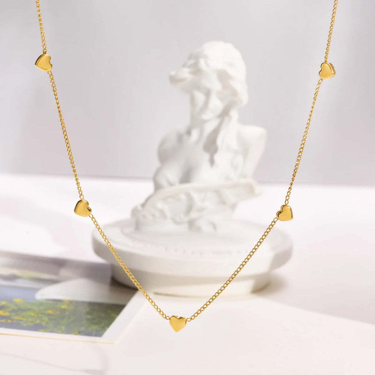 Heart Link lifestyle image, gold pendant